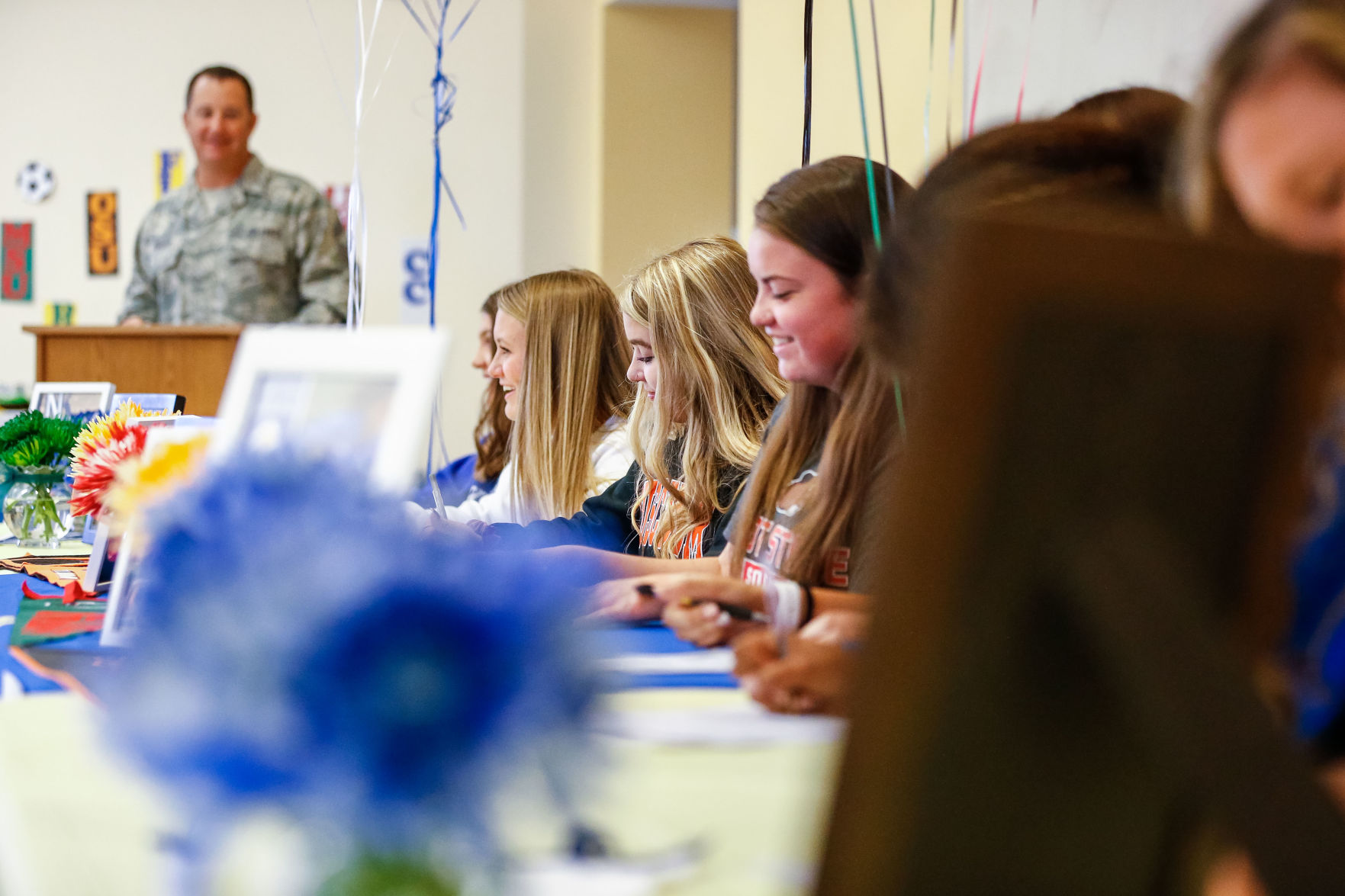 SIGNING DAY: Rampart athletes sign their National Letter of Intent
